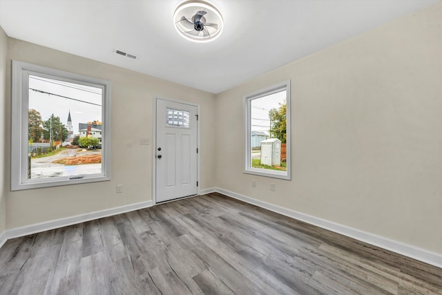 foyer entrance with light wood-type flooring