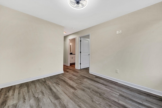 spare room with hardwood / wood-style flooring