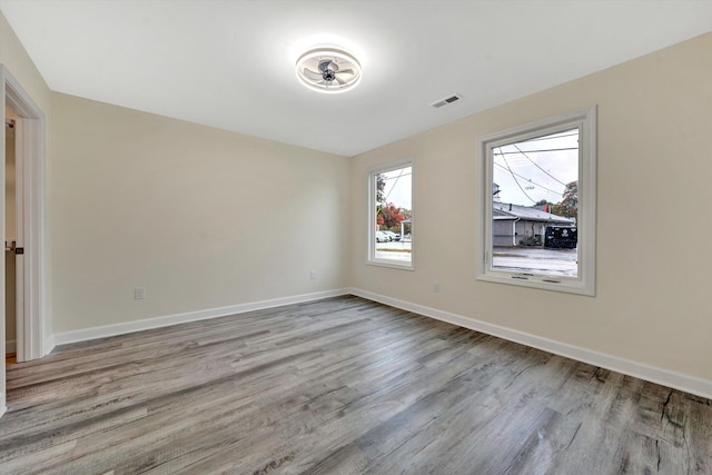 spare room featuring light hardwood / wood-style flooring