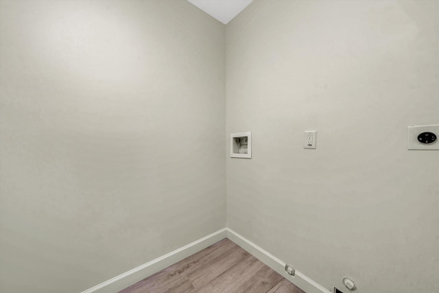 laundry room with washer hookup, hookup for a gas dryer, hookup for an electric dryer, and hardwood / wood-style floors