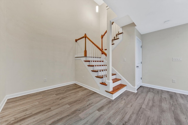 stairway with wood-type flooring