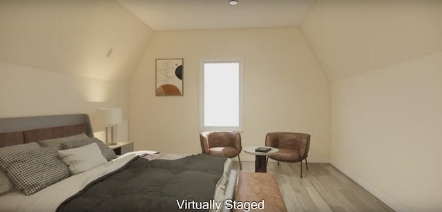 bedroom with light hardwood / wood-style flooring and vaulted ceiling