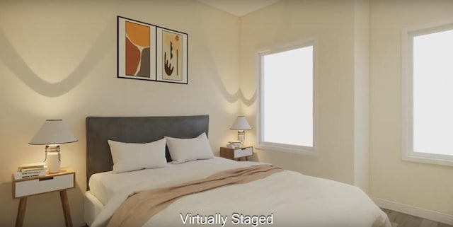 bedroom featuring wood-type flooring