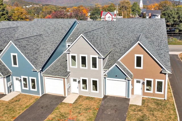 view of front facade with a front yard and a garage