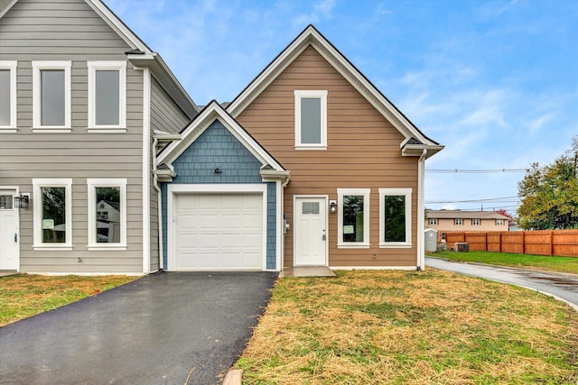 view of front facade featuring a front yard and a garage