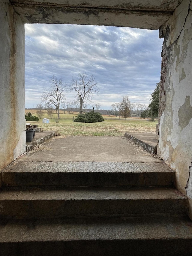 staircase with a rural view