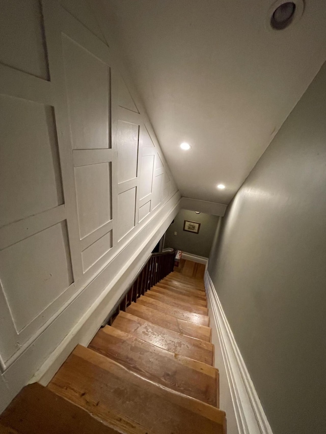 stairway with wood-type flooring