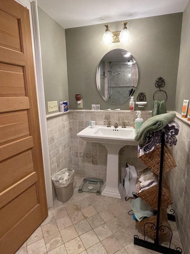 bathroom with tile walls