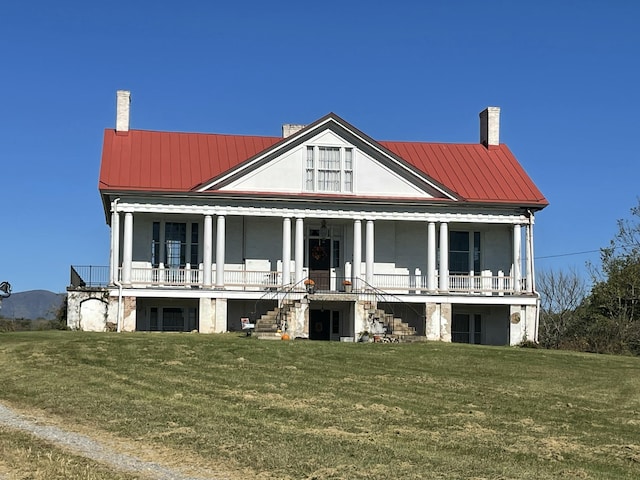 view of front facade featuring a porch and a front yard