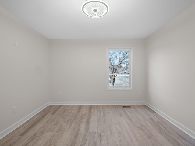 unfurnished room featuring light hardwood / wood-style floors