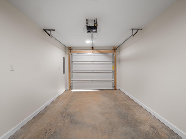 garage featuring electric panel and a garage door opener