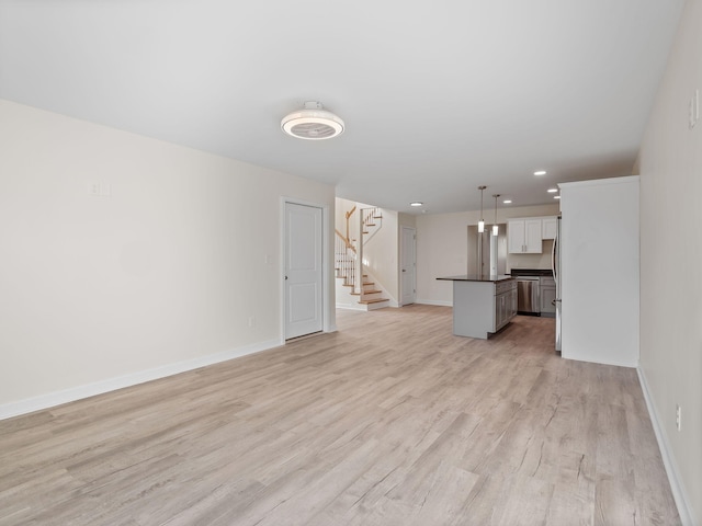 unfurnished living room with light hardwood / wood-style floors