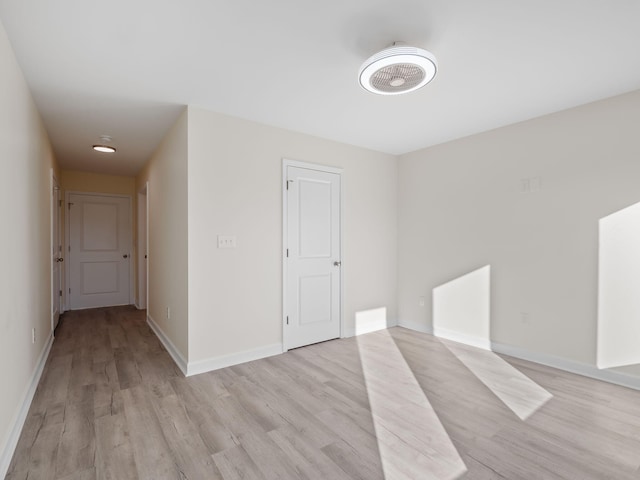 unfurnished room featuring light wood-type flooring