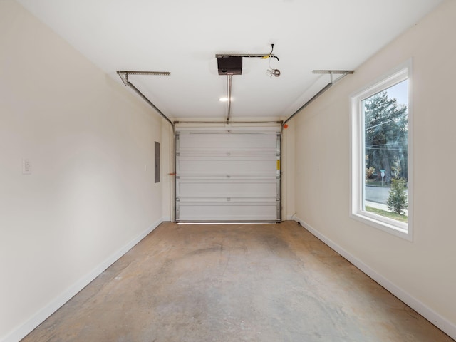 garage featuring electric panel and a garage door opener