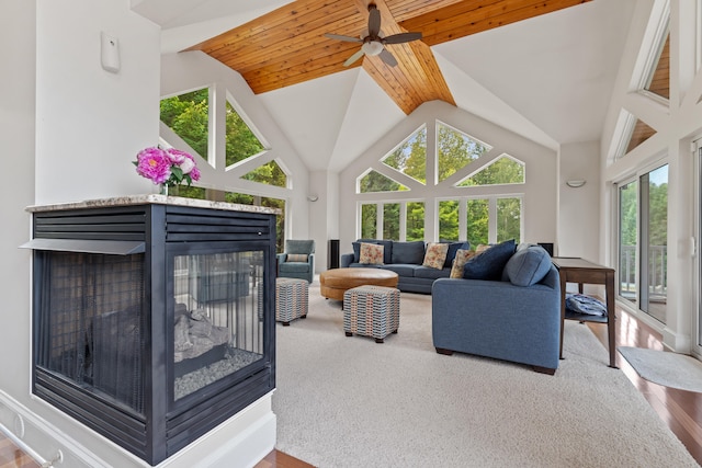 living room featuring ceiling fan, wood ceiling, hardwood / wood-style floors, and a multi sided fireplace