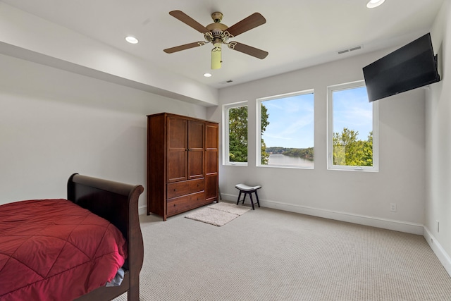 carpeted bedroom featuring ceiling fan