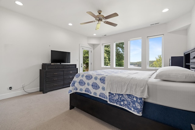 carpeted bedroom featuring ceiling fan