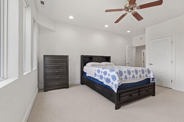 bedroom featuring ceiling fan and light carpet