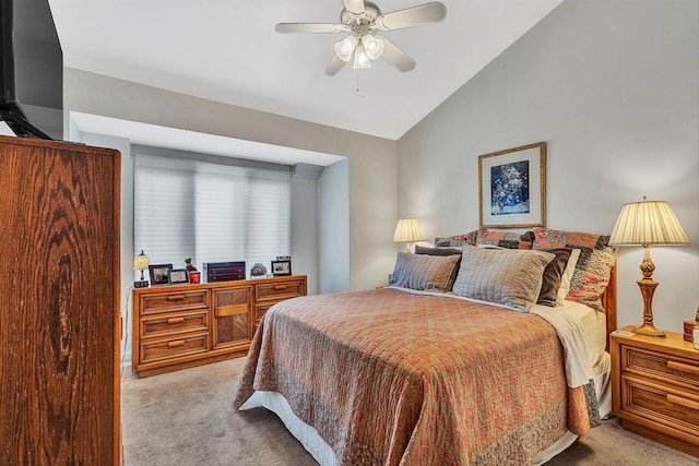 bedroom with ceiling fan, lofted ceiling, and light carpet