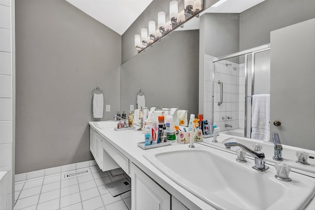 bathroom featuring double sink, vanity with extensive cabinet space, and tile flooring