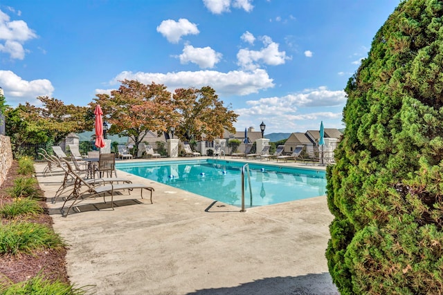 view of swimming pool featuring a patio area