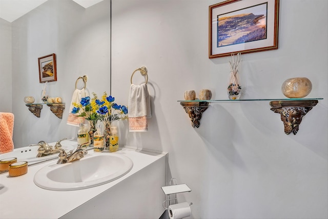 bathroom featuring vanity with extensive cabinet space