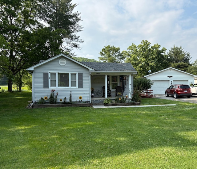 4007 Callaghan Cir, Covington, VA 24426 - view of front of property featuring covered porch, a detached garage, a front lawn, and an outbuilding