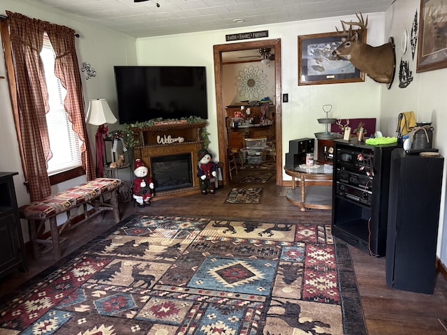 4007 Callaghan Cir, Covington, VA 24426 - living area featuring crown molding, wood finished floors, a fireplace, and ceiling fan