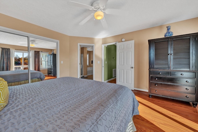 bedroom featuring ceiling fan, light hardwood / wood-style flooring, and a closet