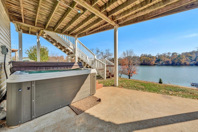 view of patio with a water view