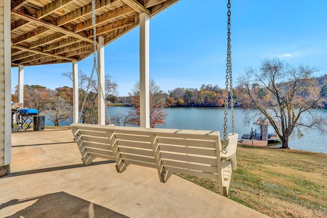 view of patio with a water view