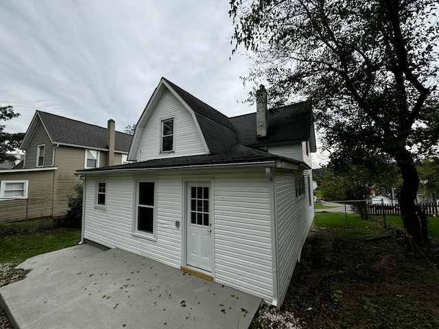 rear view of property featuring a patio