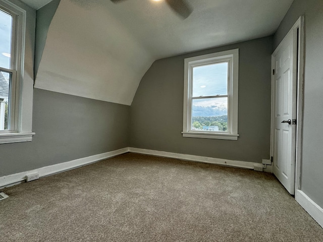 bonus room with carpet floors, lofted ceiling, and ceiling fan