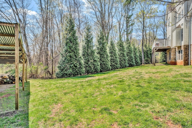 view of yard with a wooden deck