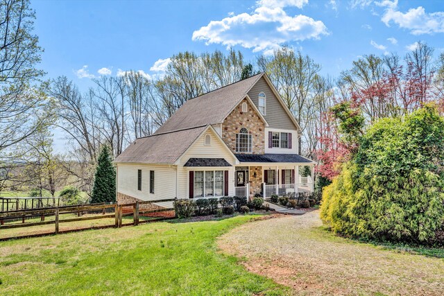 front of property with a front lawn and a porch