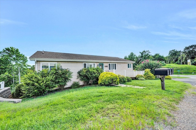 view of front of home featuring a front lawn