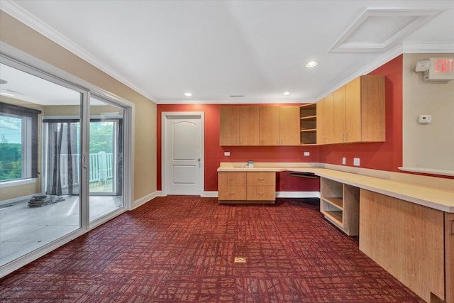kitchen featuring built in desk and crown molding