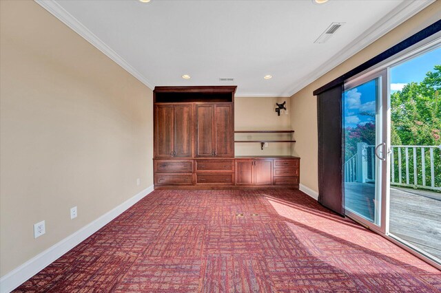 unfurnished living room with crown molding