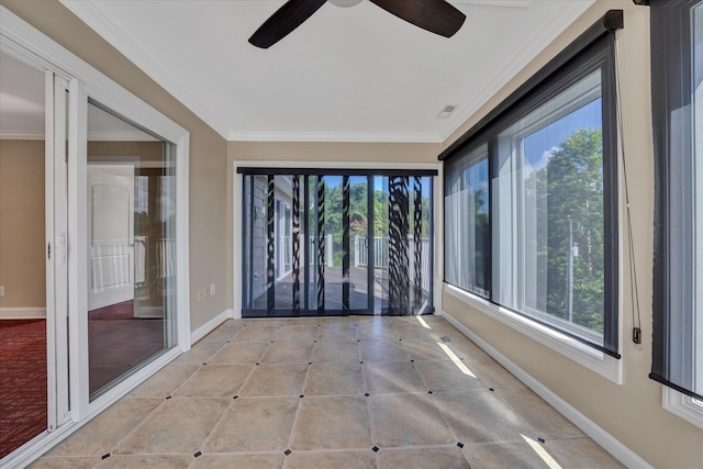 interior space featuring ceiling fan and a wealth of natural light