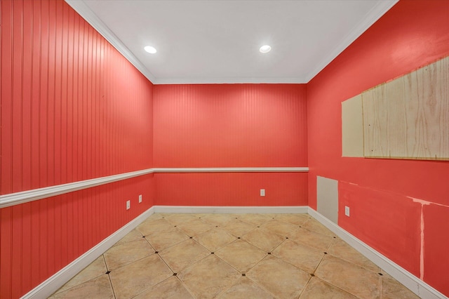 tiled empty room featuring ornamental molding