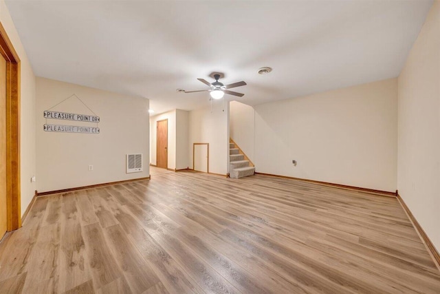 unfurnished living room featuring light hardwood / wood-style flooring and ceiling fan