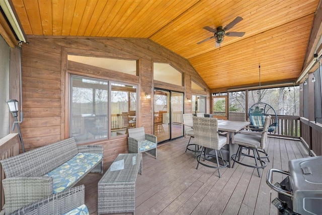 sunroom featuring plenty of natural light, wood ceiling, and vaulted ceiling