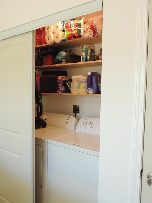 laundry area with washing machine and dryer