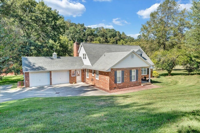 view of front of house with a garage and a front yard