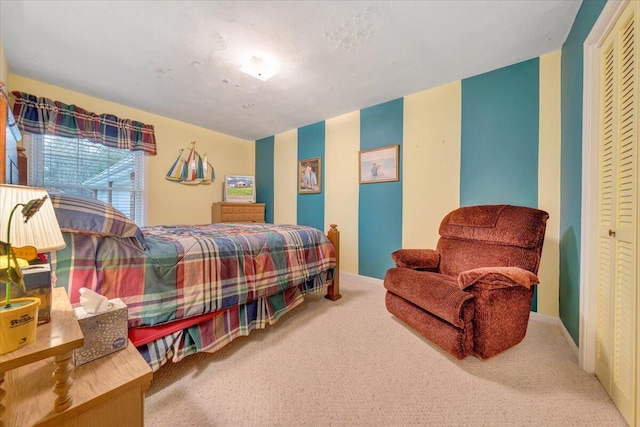 carpeted bedroom with a closet