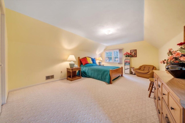 carpeted bedroom featuring vaulted ceiling