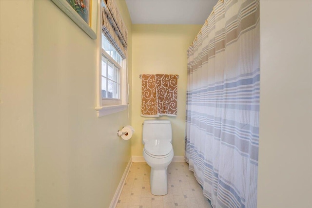1042 Old Sessler Mill Rd, Troutville, VA 24175 - full bathroom with tile patterned floors, toilet, a shower with shower curtain, and baseboards