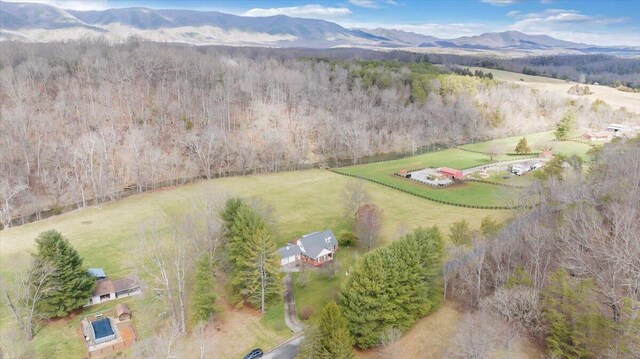 birds eye view of property featuring a mountain view and a rural view