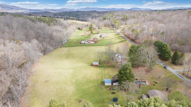 drone / aerial view featuring a mountain view and a rural view