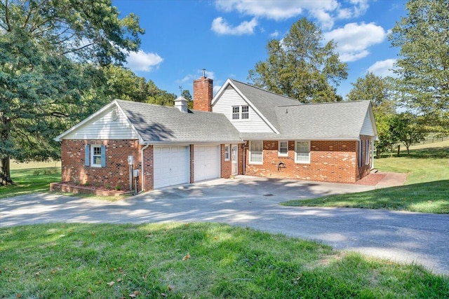 view of front of house with a garage and a front yard